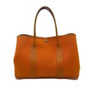 Pre-owned Oransje Hermès veske i lerret