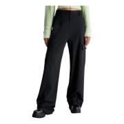 Svarte bukser med glidelås og lommer
